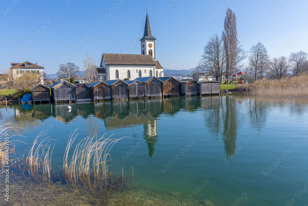 The idyllic ancient village of Busskirch, on the shores of the Upper Zurich Lake, Rapperswil-Jona, Sankt Gallen, Switzerland The idyllic ancient village of Busskirch, on the shores of the Upper Zurich Lake, Rapperswil-Jona, Sankt Gallen, Switzerland