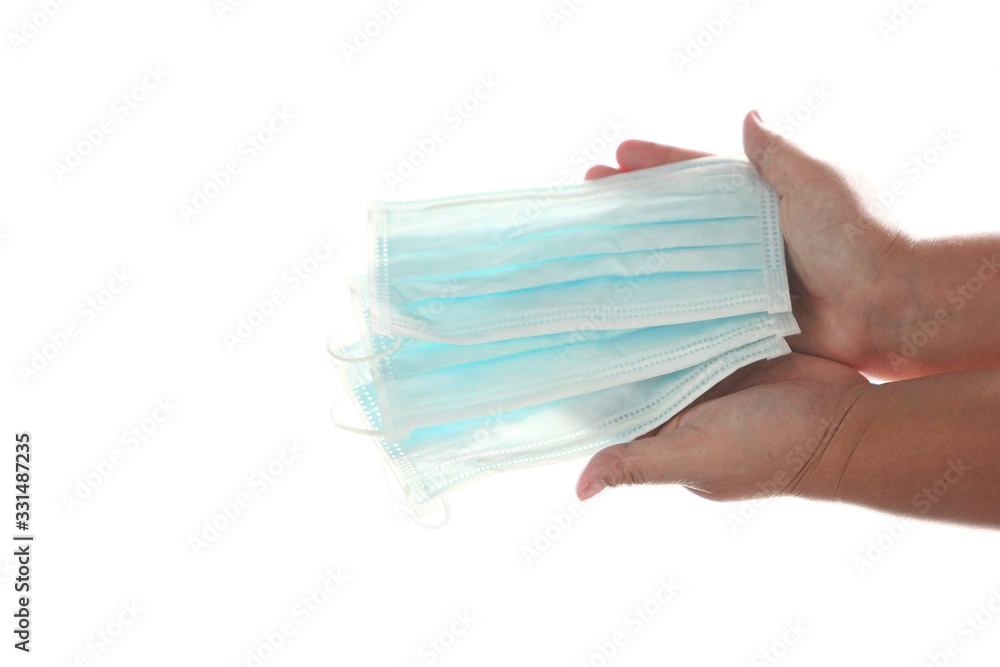 Hands holding Mask Prevent germs on white background