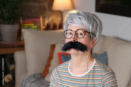 Tableau sur toile Senior woman with a mustache