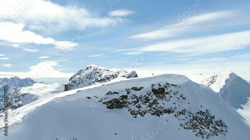 girl at the top of the mountain winter snow drone, Piz Lagrev, Schweiz photo