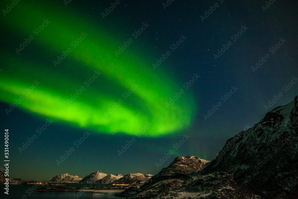 The polar arctic Northern lights hunting aurora borealis sky star in Norway travel photographer mountains. long shutter speed.