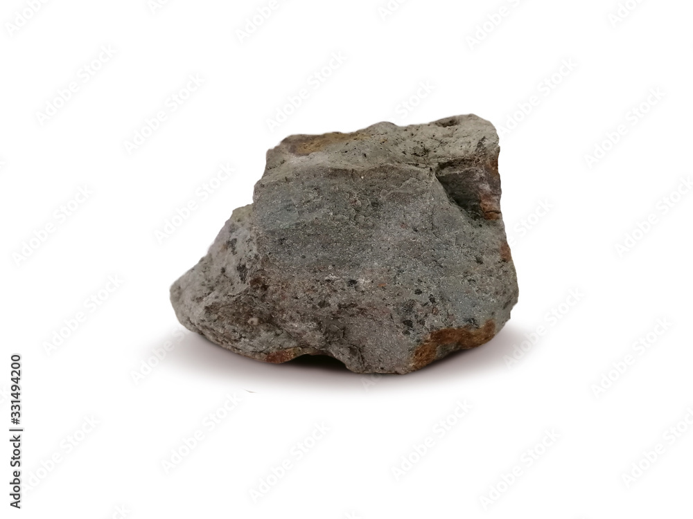 Obraz premium Tuff rock specimen on white background. Tuff is igneous rock that contains the debris from an explosive volcanic eruption.