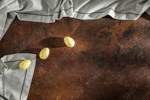 Eggs with Flat light brown beige linen background seen from above with copy space for advertising products. photo