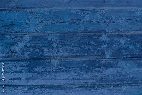 Old wooden painted dark blue boards. Horizontal view. Background. Texture.