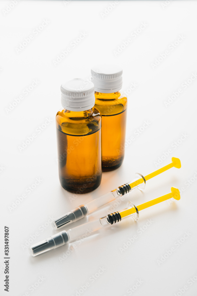 Coronavirus Vaccine, Corona virus Vaccine concept with syringe and.antidote on white background. Vaccine Concept of fight against coronavirus. Coronavirus Vaccine, Corona virus Vaccine concept with syringe and.antidote on white background. Vaccine Concept of fight against coronavirus.