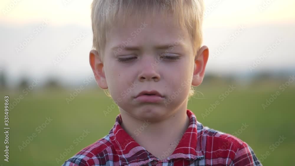 Dissatisfied, upset and unhappy child cries. Dissatisfied, upset and unhappy child cries.