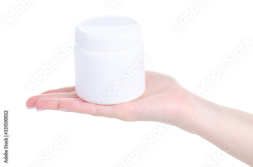 White plastic jar in hand on white background isolation