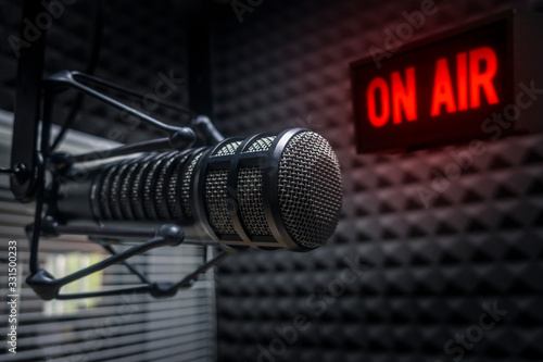 Fototapeta Professional microphone in radio station studio on air