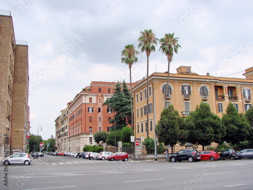 Cityscape of the outskirts of Rome on a background of cloudy summer sky.