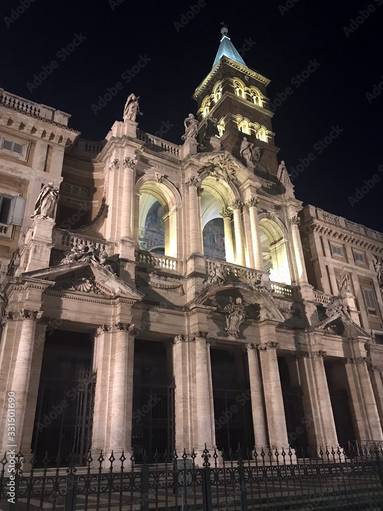 Night landscape of medieval Catholic cathedrals in the ancient central part of Rome.