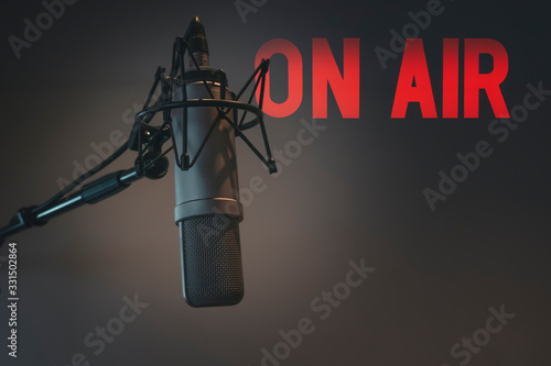 Professional microphone in radio station studio on air photo
