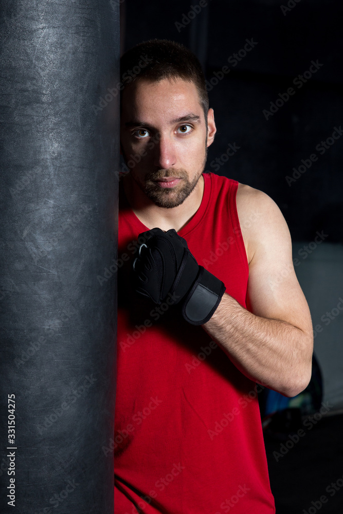 Man Holding A Boxing Bag