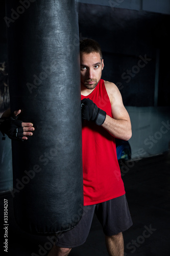 Man Holding A Boxing Bag © Feel The Images