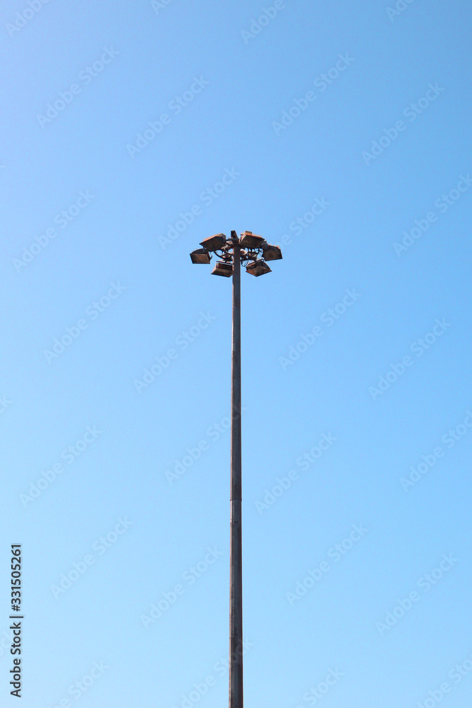 strong light post for sport statium on clear blue sky strong light post for sport statium on clear blue sky