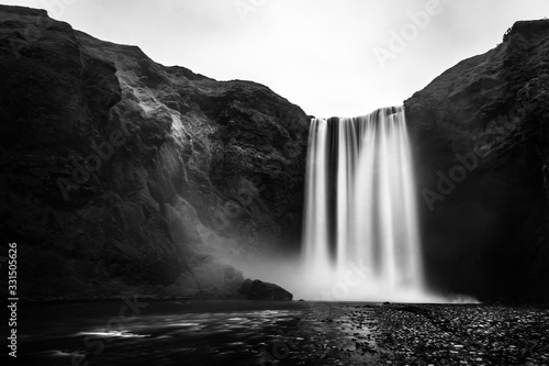 The Skógafoss iconic waterfall in Iceland in black and white