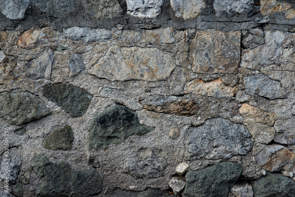 Texture of stone wall made of grey stones Texture of stone wall made of grey stones