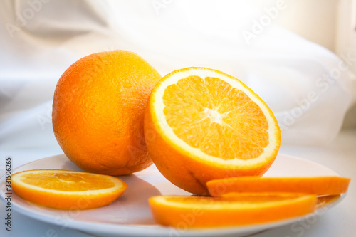 fresh oranges on a plate