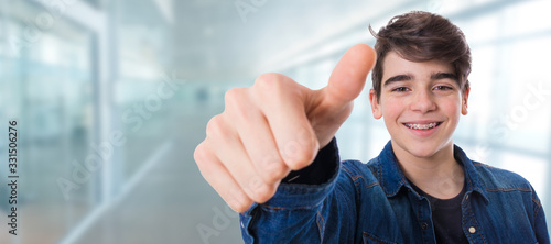 child or teenager with okay or approval sign smiling with braces