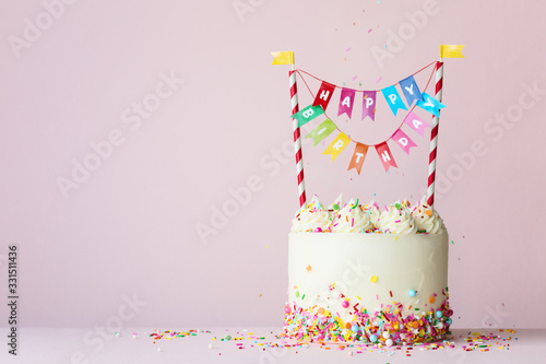 Wall Mural Birthday cake with colorful happy birthday banner