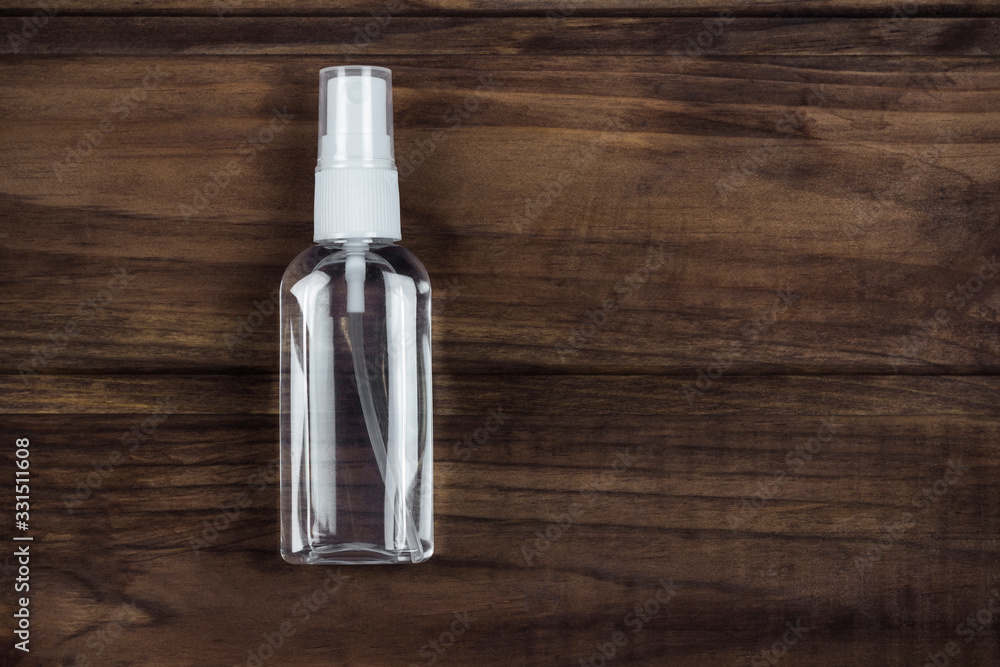 personal antiseptic spray on a wooden background personal antiseptic spray on a wooden background