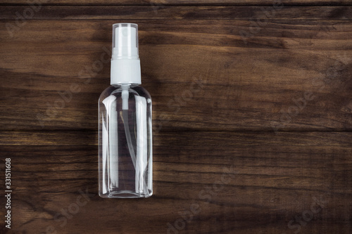 personal antiseptic spray on a wooden background