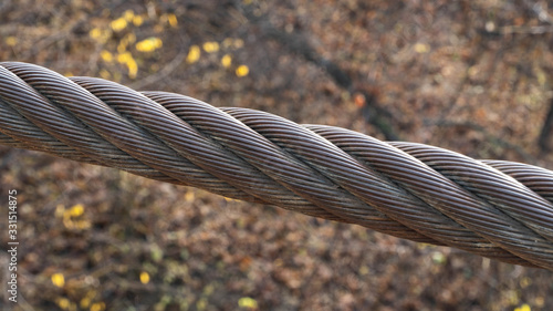 steel cable holding bridge at height