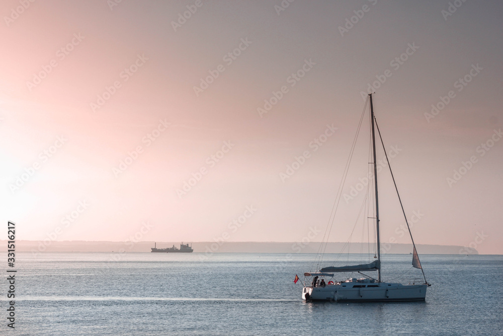 ships and boats on the Meditteranean Sea in the Balearic island Mallorca with sunset