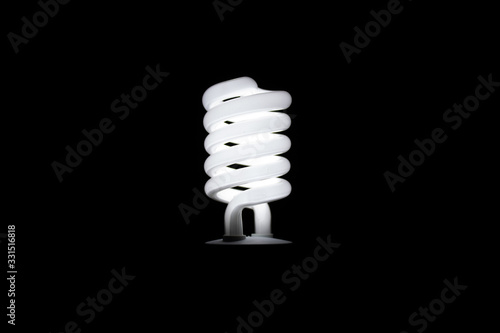 energy saving bulb on black background