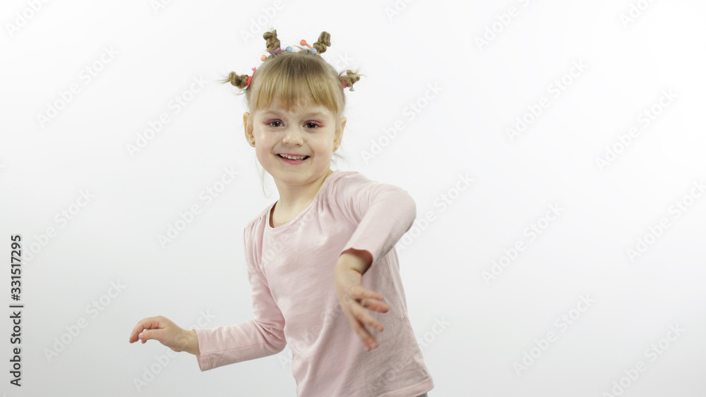 Positive girl in pink blouse dancing. Happy four little child. White background Positive girl in pink blouse dancing. Happy four little child. White background