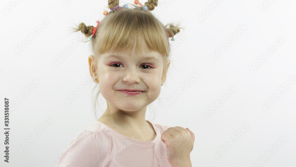 Positive girl emotionally make faces and smile in pink blouse. White background Positive girl emotionally make faces and smile in pink blouse. White background