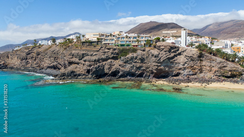 Morro Jable Canary Island  Fuerteventura Spain  Aerial view on coast of atlantic ocean and beach  Drone shot of sea 