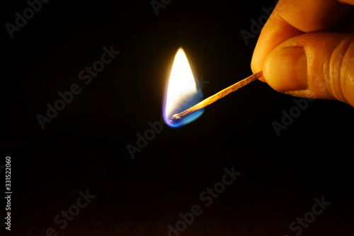 Obraz na płótnie Burning match in a hand w salonie