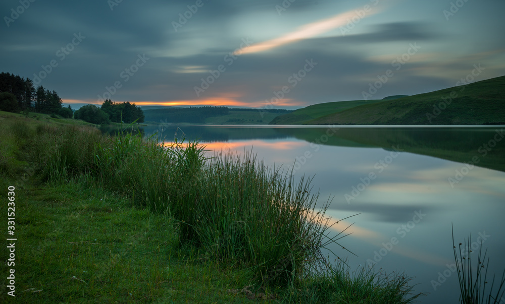 Fototapeta premium Sunset and reflection on Lake, Llyn Clywedog