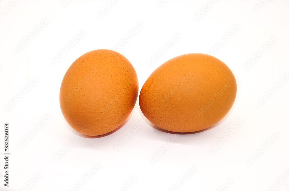 two chicken eggs on a white background two chicken eggs on a white background