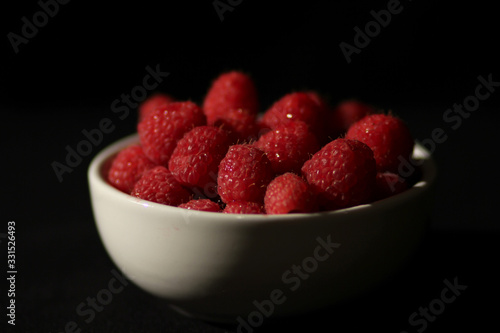 Bowl of Raspberries on Black