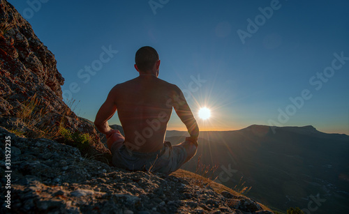 traveler meditate on mountain