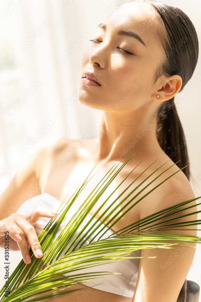 Pretty Asian woman is enjoying sunny day Pretty Asian woman is enjoying sunny day