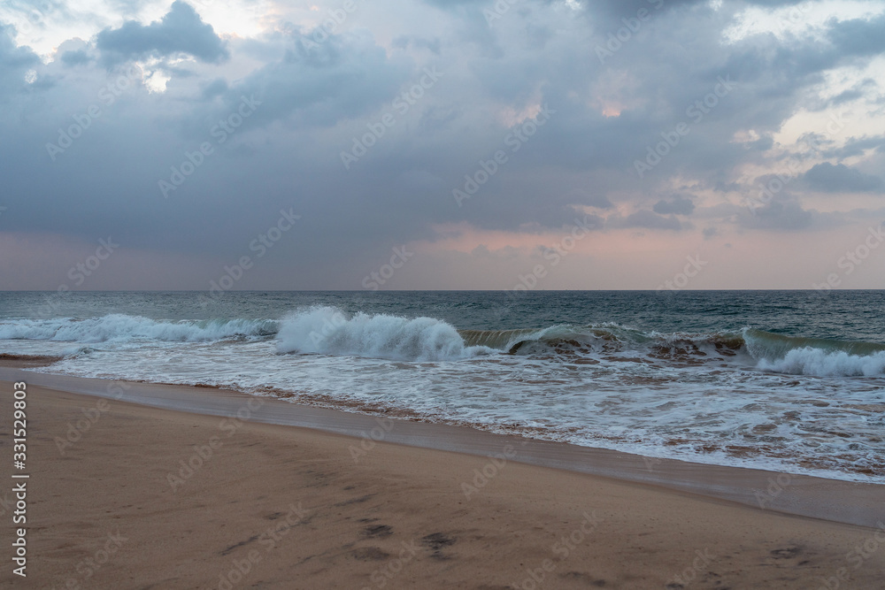Sri Lanka ocean waves on resorts sand beach with palm tree. Sri Lanka ocean waves on resorts sand beach with palm tree.