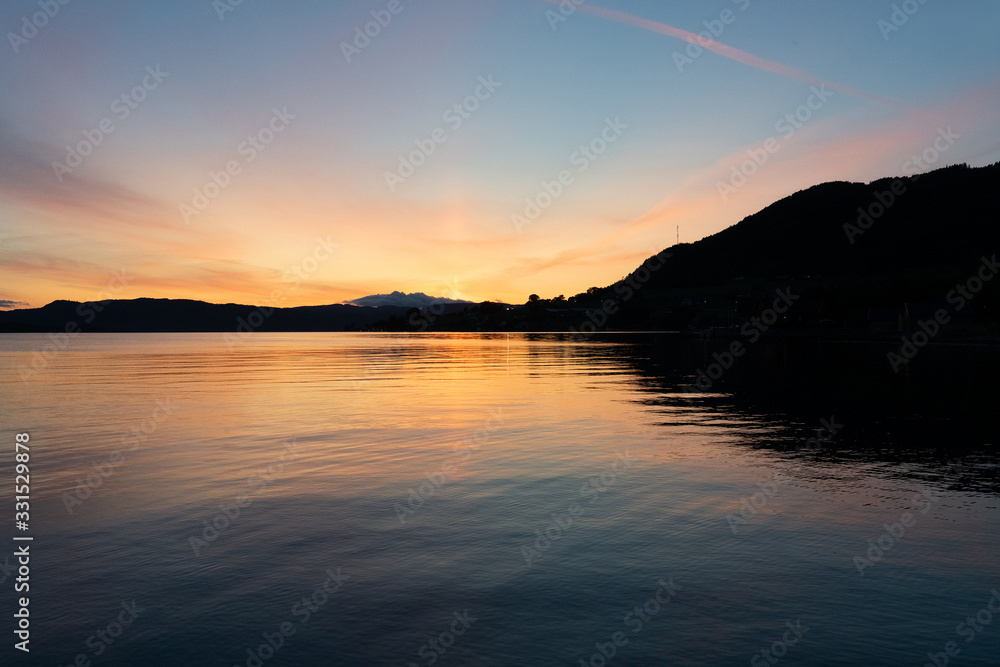 Norwegian fjords sea mountain landscape. Sunset evening view, Rosendal, Norway.