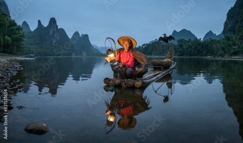 Chinese cormorant fisherman in Guilin, China photo