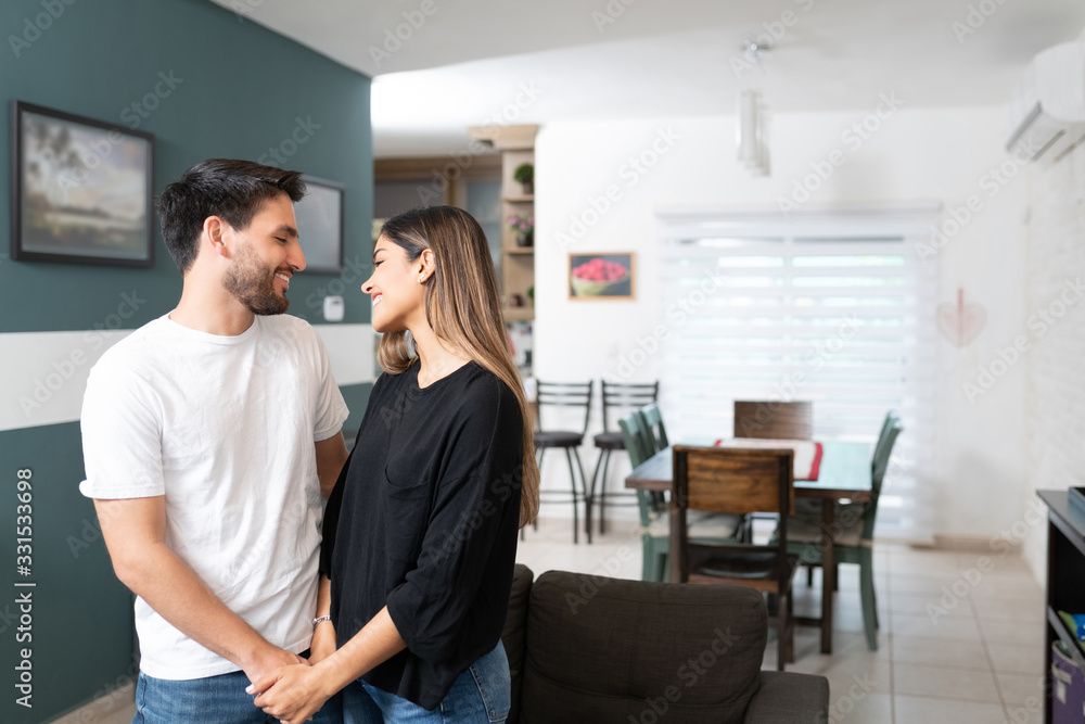 Smiling Hispanic Couple At Home Smiling Hispanic Couple At Home