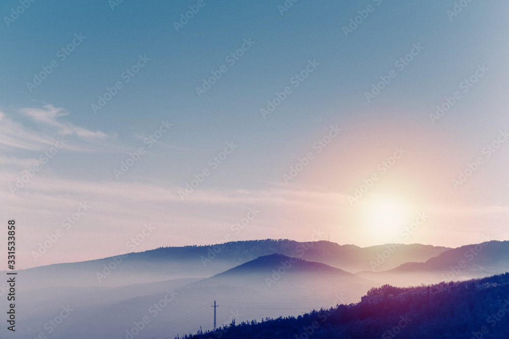 Fototapeta premium mountain with fog at sunset