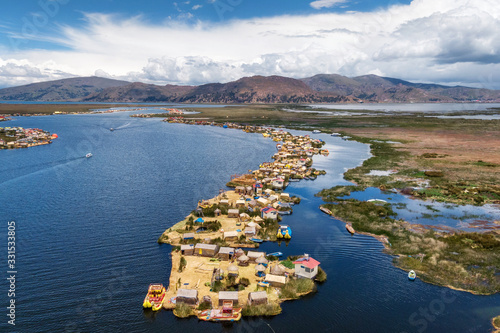 Photos Aerial view of Uros Floating Islands on Lake Titicaca, the highest navigable lake in the world, on the border of Peru and Bolivia, South America
