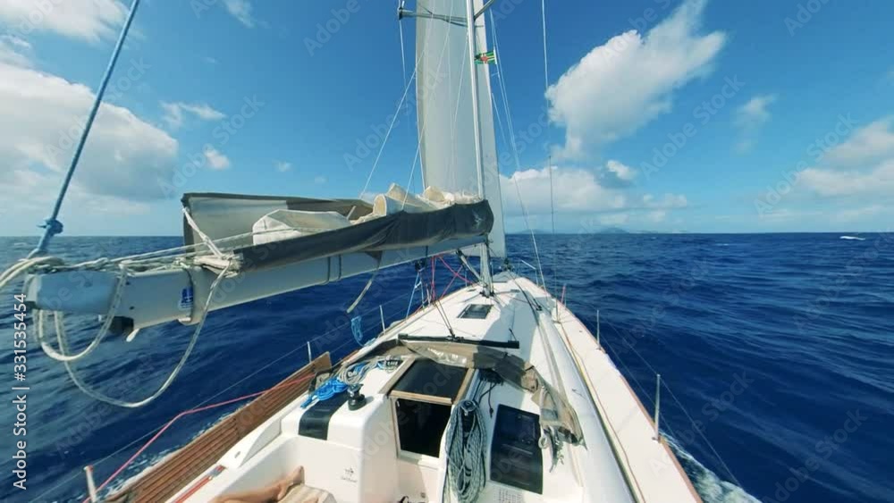 Prow of a sailboat crossing the waters in a first-person view Prow of a sailboat crossing the waters in a first-person view