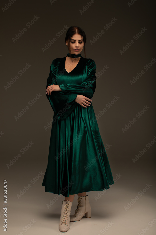 Cute woman in gorgeous green dress. Cute woman in gorgeous green dress.