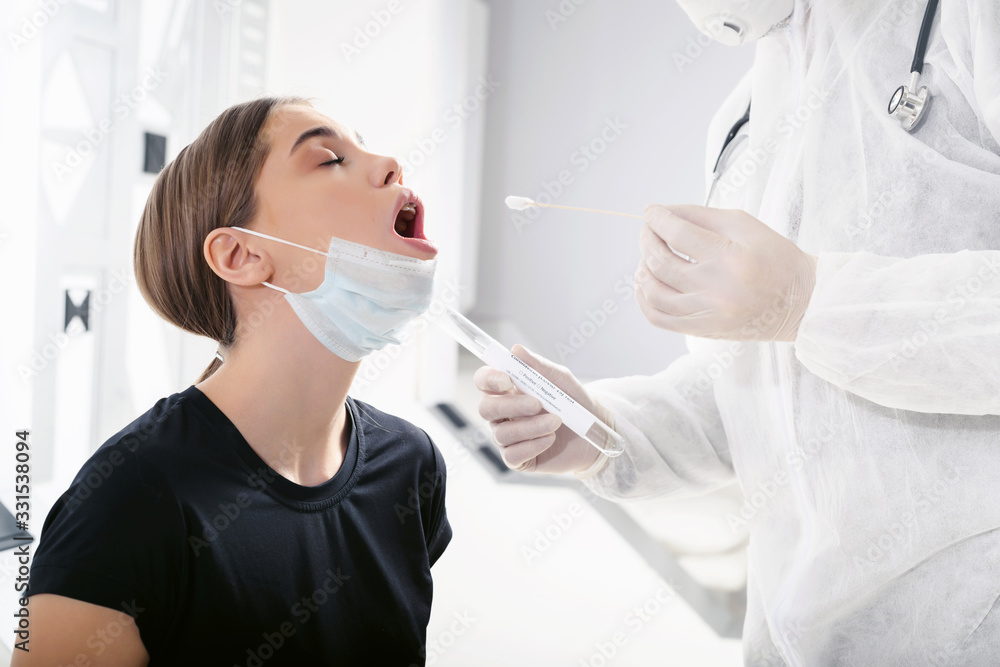 Doctor epidemiologist virologist takes a sample of biological material ...