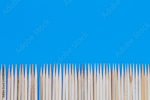 Thin pointed sticks on a blue background