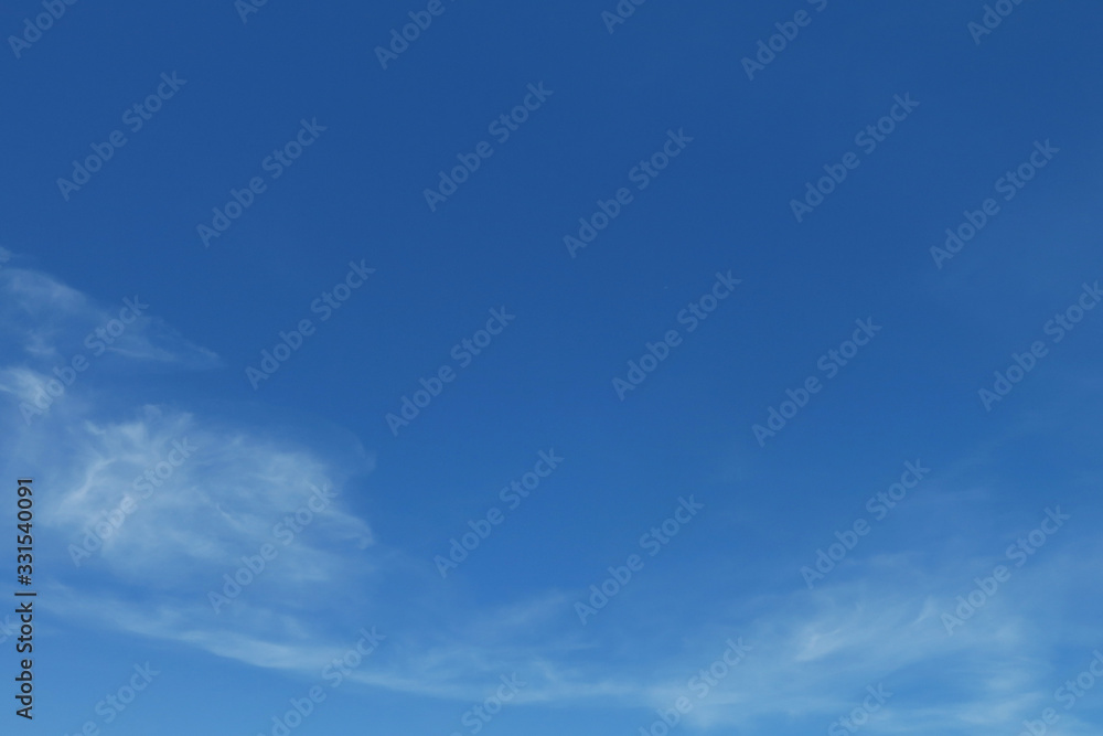 Fototapeta premium Blue sunny sky with clouds