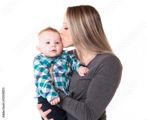 A mother with the baby boy on studio white background