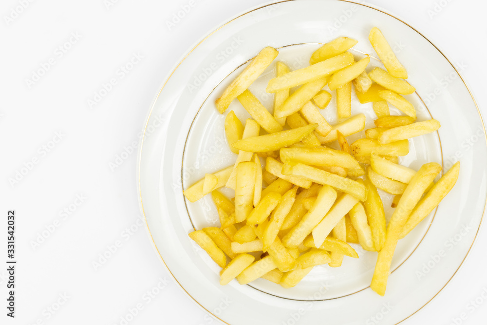 French Fries served on the white plate French Fries served on the white plate